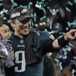 Philadelphia Eagles quarterback Nick Foles (9) holds his daughter, Lily James, after winning the NFL Super Bowl 52 football game against the New England Patriots, Sunday, Feb. 4, 2018, in Minneapolis. The Eagles won 41-33. (AP Photo/Frank Franklin II)