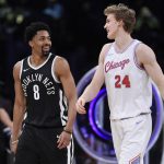Brooklyn Nets' Spencer Dinwiddie, left, talks with Chicago Bulls' Lauri Markkanen after Dinwiddie defeated Markkanen in the final round of the Skills Challenge, part of the NBA basketball All-Star weekend, Saturday, Feb. 17, 2018, in Los Angeles. (AP Photo/Chris Pizzello)