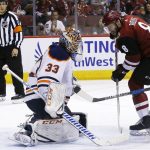 Arizona Coyotes right wing Tobias Rieder (8) has his shot turned away by Edmonton Oilers goaltender Cam Talbot (33) during the second period of an NHL hockey game Saturday, Feb. 17, 2018, in Glendale, Ariz. (AP Photo/Ross D. Franklin)