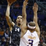 San Antonio Spurs guard Danny Green (14) shoots over Phoenix Suns forward Jared Dudley during the first half of an NBA basketball game Wednesday, Feb. 7, 2018, in Phoenix. (AP Photo/Ross D. Franklin)
