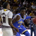 UCLA guard Aaron Holiday (3) drives on Arizona State guard Shannon Evans II in the first half during an NCAA college basketball game, Saturday, Feb. 10, 2018, in Tempe, Ariz. (AP Photo/Rick Scuteri)