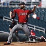 Arizona Diamondbacks pitcher Robbie Ray throws against the Cincinnati Reds during the first inning of a spring training baseball game Monday, Feb. 26, 2018, in Goodyear, Ariz. (AP Photo/Ross D. Franklin)