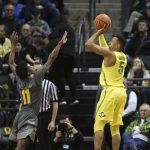Oregon's Elijah Brown, right, goes up for a 3-pointer over Arizona State's Shannon Evans II during the second half of an NCAA college basketball game Thursday, Feb. 22, 2018, in Eugene, Ore. (AP Photo/Chris Pietsch)