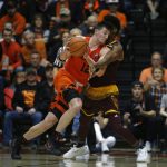 Oregon State's Drew Eubanks (12) tries to get past Arizona State's De'Quon Lake, rear, in the second half of an NCAA college basketball game in Corvallis, Ore., Saturday, Feb. 24, 2018. (AP Photo/Timothy J. Gonzalez)