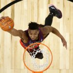 Utah Jazz's Donovan Mitchell competes in the NBA basketball All-Star weekend slam dunk contest Saturday, Feb. 17, 2018, in Los Angeles. Mitchell won the event. (Bob Donnan/Pool via AP)
