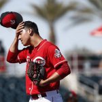 Cincinnati Reds pitcher Robert Stephenson wipes his forehead after giving up a two-run home run to Arizona Diamondbacks' Jeremy Hazelbaker during the second inning of a spring training baseball game Monday, Feb. 26, 2018, in Goodyear, Ariz. (AP Photo/Ross D. Franklin)