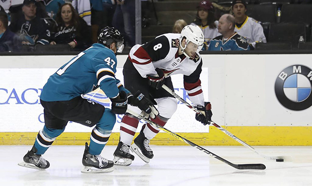 Arizona Coyotes right wing Tobias Rieder (8), from Germany, moves the puck up the ice past San Jose...