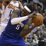 Los Angeles Clippers forward Montrezl Harrell (5) pulls a rebound away from Phoenix Suns' T.J. Warren during the second half of an NBA basketball game Friday, Feb. 23, 2018, in Phoenix. (AP Photo/Ralph Freso)