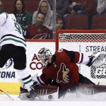 Arizona Coyotes goaltender Scott Wedgewood, right, makes a save on a shot by Dallas Stars center Tyler Seguin during the second period of an NHL hockey game Thursday, Feb. 1, 2018, in Glendale, Ariz. The Stars defeated the Coyotes 4-1. (AP Photo/Ross D. Franklin)