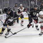 Arizona Coyotes left winger Brendan Perlini, right, and Los Angeles Kings center Anze Kopitar (11) vie for the puck during the first period of an NHL hockey game in Los Angeles on Saturday, Feb. 3, 2018. (AP Photo/Reed Saxon)