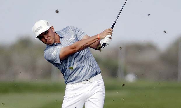 Rickie Fowler hits from the fairway on the fifth hole hole of the North Course at Torrey Pines Golf...