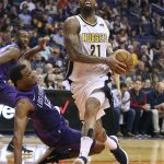 Denver Nuggets forward Wilson Chandler (21) drives to the basket past Phoenix Suns' T.J. Warren (12) during the second half of an NBA basketball game Saturday, Feb. 10, 2018, in Phoenix. (AP Photo/Ralph Freso)