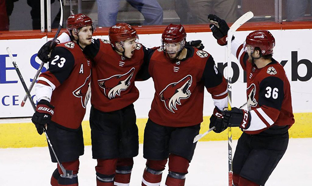 Arizona Coyotes center Clayton Keller (9) celebrates his goal against the Montreal Canadiens with d...