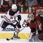 Edmonton Oilers center Ryan Strome (18) has his shot stopped by Arizona Coyotes defenseman Jakob Chychrun, back right, as Coyotes goaltender Antti Raanta, front right, defends the goal during the second period of an NHL hockey game Saturday, Feb. 17, 2018, in Glendale, Ariz. (AP Photo/Ross D. Franklin)