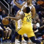 Utah Jazz guard Donovan Mitchell (45) collides with Phoenix Suns forward Jared Dudley, back, during the second half of an NBA basketball game Friday, Feb. 2, 2018, in Phoenix. The Jazz defeated the Suns 129-97. (AP Photo/Ross D. Franklin)