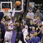 Arizona's Deandre Ayton blocks a shot by Washington's Jaylen Nowell shot in the closing seconds of an NCAA college basketball game Saturday, Feb. 3, 2018, in Seattle. The ball was recovered by Dominic Green, who made the winning shot as Washington won 78-75. (AP Photo/John Froschauer)