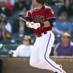 Arizona Diamondbacks' A.J. Pollock swings for a double against the Colorado Rockies during the first inning of a spring training baseball game on Wednesday, Feb. 28, 2018, in Scottsdale, Ariz. (AP Photo/Ben Margot)