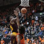 Arizona State's Romello White, rear, goes to the basket while guarded by Oregon State's Ethan Thompson, front. in the first half of an NCAA college basketball game in Corvallis, Ore., Saturday, Feb. 24, 2018. (AP Photo/Timothy J. Gonzalez)