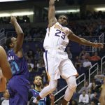 Phoenix Suns forward Danuel House (23) dunks over Charlotte Hornets' Treveon Graham (21) during the second half of an NBA basketball game Sunday, Feb. 4, 2018, in Phoenix. (AP Photo/Ralph Freso)