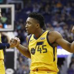 After being fouled on a 3-point basket, Utah Jazz guard Donovan Mitchell (45) is helped up off the floor by guards Ricky Rubio (3) and Joe Johnson, right, during the first half of an NBA basketball game Friday, Feb. 2, 2018, in Phoenix. (AP Photo/Ross D. Franklin)
