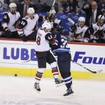 Arizona Coyotes' Jordan Martinook (48) is hit by Winnipeg Jets' Dustin Byfuglien (33) during first period NHL hockey action in Winnipeg, Manitoba Tuesday, Feb. 6, 2018. (Trevor Hagan/The Canadian Press via AP)