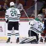 Dallas Stars goaltender Kari Lehtonen, right, reacts after giving up a goal to Arizona Coyotes' Kevin Connauton, as Stars defenseman Stephen Johns (28) stands in front of the goal during the first period of an NHL hockey game Thursday, Feb. 1, 2018, in Glendale, Ariz. (AP Photo/Ross D. Franklin)