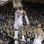 Arizona's Deandre Ayton dunks the ball on a turnover against Washington during the first half of an NCAA college basketball game Saturday, Feb. 3, 2018 in Seattle. (AP Photo/John Froschauer)