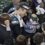 Philadelphia Eagles quarterback Nick Foles celebrates with his daughter, Lily, and wife, Tori Moore, after the NFL Super Bowl 52 football game against the New England Patriots, Sunday, Feb. 4, 2018, in Minneapolis. The Eagles won 41-33. (AP Photo/Eric Gay)