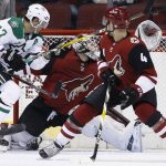 Arizona Coyotes goaltender Scott Wedgewood, middle, gives up a goal to Dallas Stars' Tyler Seguin as Stars right wing Alexander Radulov (47) and Coyotes defenseman Niklas Hjalmarsson (4) look for the puck during the second period of an NHL hockey game Thursday, Feb. 1, 2018, in Glendale, Ariz. (AP Photo/Ross D. Franklin)