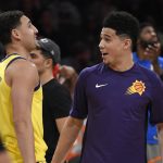 Phoenix Suns' Devin Booker, right, is congratulated by Golden State Warriors' Klay Thompson after winning the NBA All-Star basketball 3-Point contest, Saturday, Feb. 17, 2018, in Los Angeles. (AP Photo/Chris Pizzello)