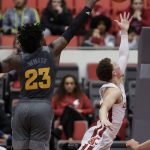Washington State guard Malachi Flynn, right, shoots in front of Arizona State forward Romello White (23) during the second half of an NCAA college basketball game in Pullman, Wash., Sunday, Feb. 4, 2018. (AP Photo/Young Kwak)