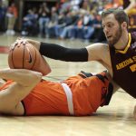 Oregon State's Tres Tinkle, left, fights for the ball with Arizona State's Mickey Mitchell (3) in the first half of an NCAA college basketball game in Corvallis, Ore., Saturday, Feb. 24, 2018. (AP Photo/Timothy J. Gonzalez)