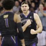 Washington's Sam Timmins reacts after scoring against Arizona during the first half of an NCAA college basketball game Saturday, Feb. 3, 2018 in Seattle. (AP Photo/John Froschauer)
