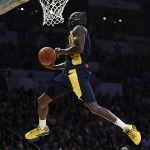 Indiana Pacers' Victor Oladipo dunks while wearing a mask from the movie "Black Panther" during the NBA All-Star basketball Slam Dunk contest, Saturday, Feb. 17, 2018, in Los Angeles. (AP Photo/Chris Pizzello)