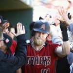 Arizona Diamondbacks' Jeremy Hazelbaker celebrates his two-run home run against the Cincinnati Reds with teammates during the second inning of a spring training baseball game Monday, Feb. 26, 2018, in Goodyear, Ariz. (AP Photo/Ross D. Franklin)