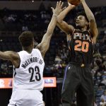 Phoenix Suns forward Josh Jackson (20) shoots against Memphis Grizzlies guard Ben McLemore (23) in the second half of an NBA basketball game Wednesday, Feb. 28, 2018, in Memphis, Tenn. (AP Photo/Brandon Dill)