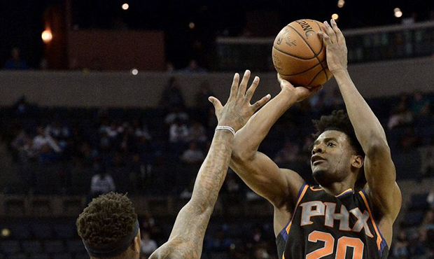 Phoenix Suns forward Josh Jackson (20) shoots against Memphis Grizzlies guard Ben McLemore (23) in ...