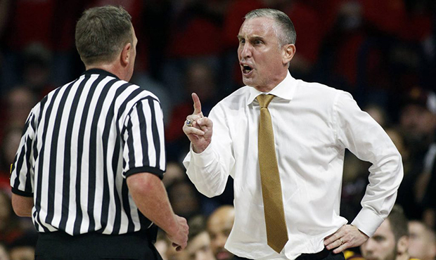 Arizona State coach Bobby Hurley, right, makes his point to official Dave Hall during the second ha...