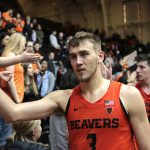 Oregon State's Tres Tinkle (3) and Drew Eubanks, rear, greet fans after an NCAA college basketball game against Arizona State in Corvallis, Ore., Saturday, Feb. 24, 2018. (AP Photo/Timothy J. Gonzalez)