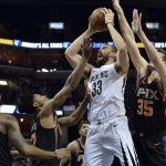 Memphis Grizzlies center Marc Gasol (33) shoots against Phoenix Suns guard Troy Daniels (30), guard Elfrid Payton, second from left, and forward Dragan Bender (35) in the first half of an NBA basketball game Wednesday, Feb. 28, 2018, in Memphis, Tenn. (AP Photo/Brandon Dill)