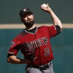 Arizona Diamondbacks pitcher Robbie Ray warms up during the first inning of a spring training baseball game against the Cincinnati Reds, Monday, Feb. 26, 2018, in Goodyear, Ariz. (AP Photo/Ross D. Franklin)