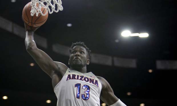 Arizona forward Deandre Ayton (13) dunks against Oregon State in the second half during an NCAA col...