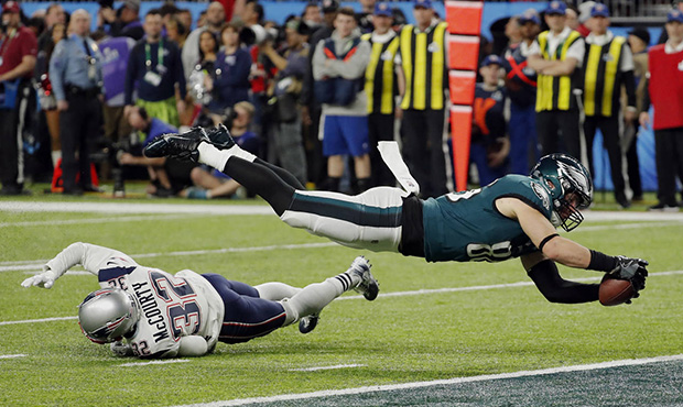 Philadelphia Eagles tight end Zach Ertz (86) dives into the end zone over New England Patriots free...