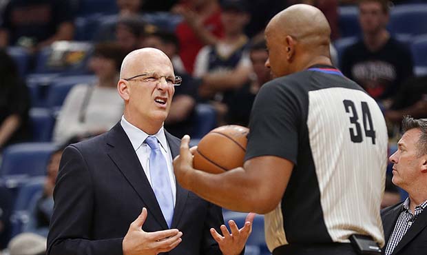 Phoenix Suns head coach Jay Triano challenges an official in the first half of an NBA basketball ga...