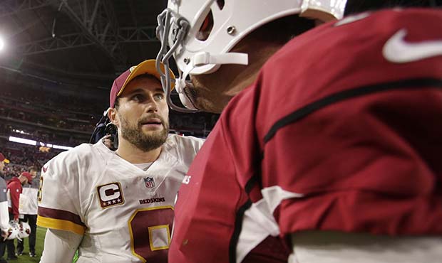 Washington Redskins quarterback Kirk Cousins (8) greets Arizona Cardinals quarterback Carson Palmer...
