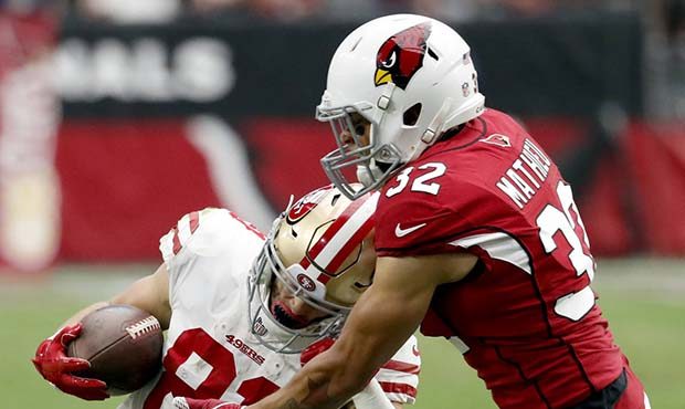 San Francisco 49ers wide receiver Trent Taylor (81) is hit by Arizona Cardinals free safety Tyrann ...