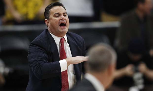 Arizona head coach Sean Miller directs his team against Colorado in the first half of an NCAA colle...