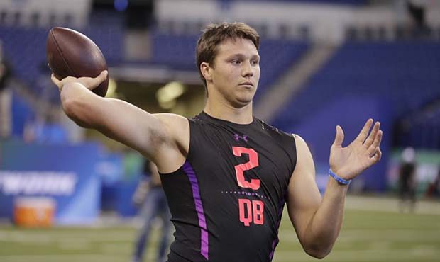 Wyoming quarterback Josh Allen runs a drill at the NFL football scouting combine in Indianapolis, S...