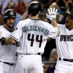Arizona Diamondbacks' Paul Goldschmidt (44) high-fives Ketel Marte (4) and David Peralta after hitting a three run home against the Colorado Rockies during the first inning of the National League wild-card playoff baseball game, Wednesday, Oct. 4, 2017, in Phoenix. (AP Photo/Ross D. Franklin)