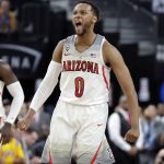 Arizona's Parker Jackson-Cartwright celebrates during overtime in an NCAA college basketball game against UCLA in the semifinals of the Pac-12 men's tournament Friday, March 9, 2018, in Las Vegas. Arizona won 78-67. (AP Photo/Isaac Brekken)